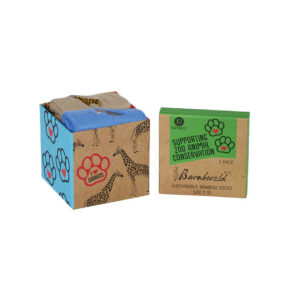 Gift box with paw print on side and panda print on other side with two pairs of socks included inside. Black text reads "Bamboozld supporting zoo animal conservation"