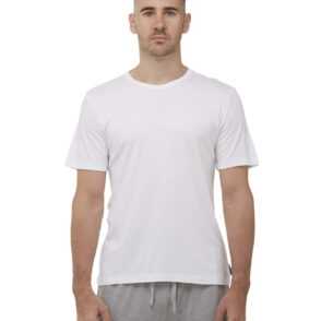 Man standing with hands at his sides wearing white bamboo sleep tshirt and grey shorts